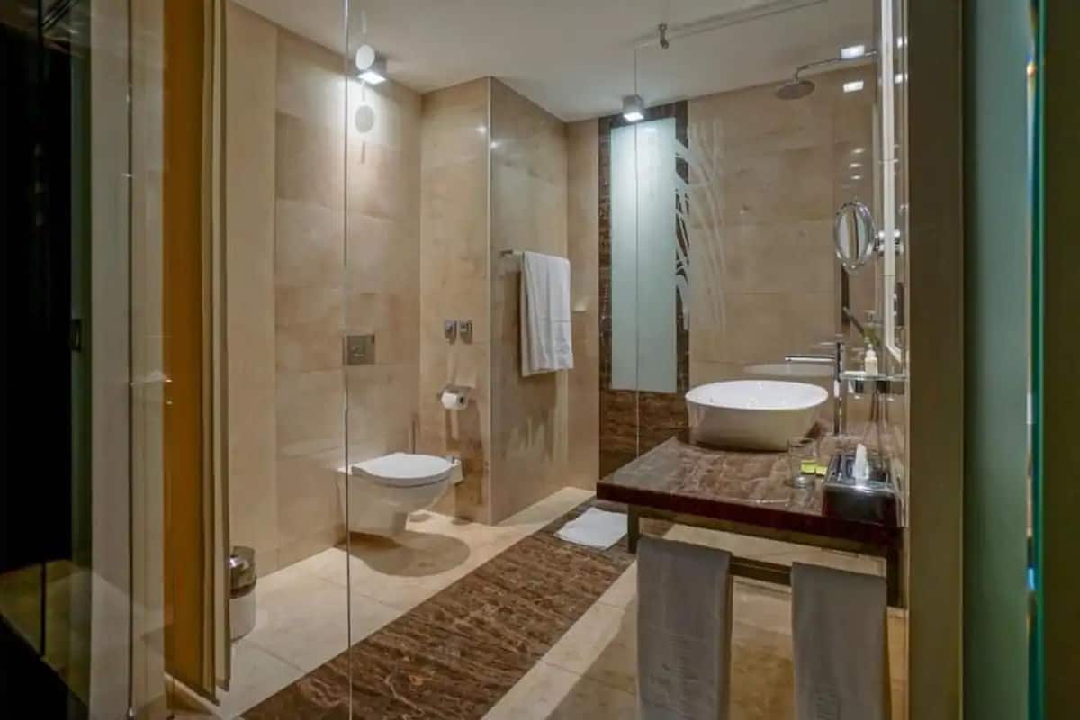 shower, designer toiletries, towels