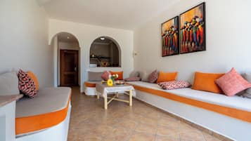 Deluxe Apartment, Pool View | Living area | LCD TV