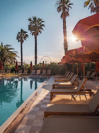 Outdoor pool, open 10:00 AM to 9:00 PM, free cabanas, pool umbrellas