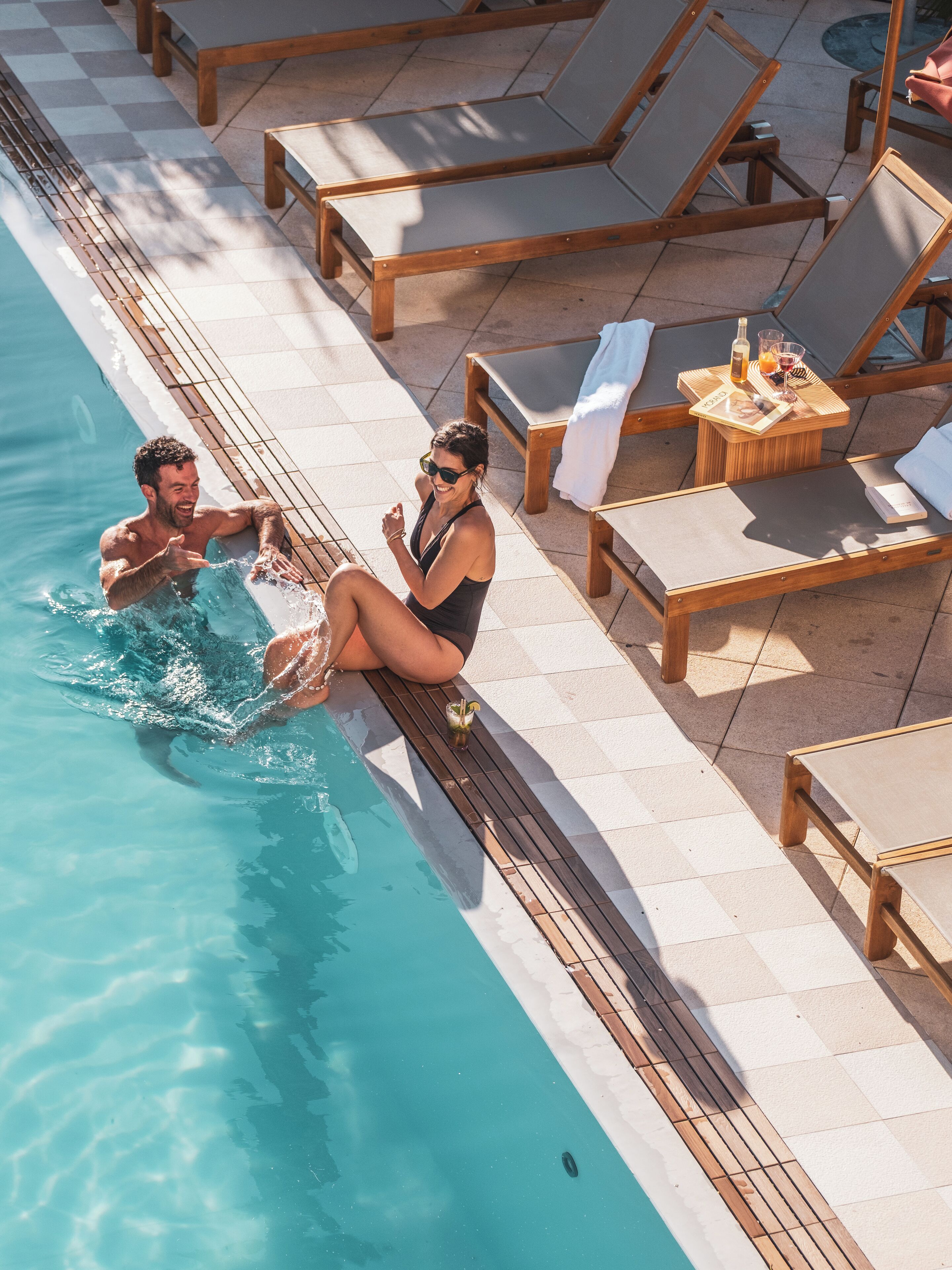 seasonal outdoor pool, open 10:00 am to 7:00 pm, pool umbrellas