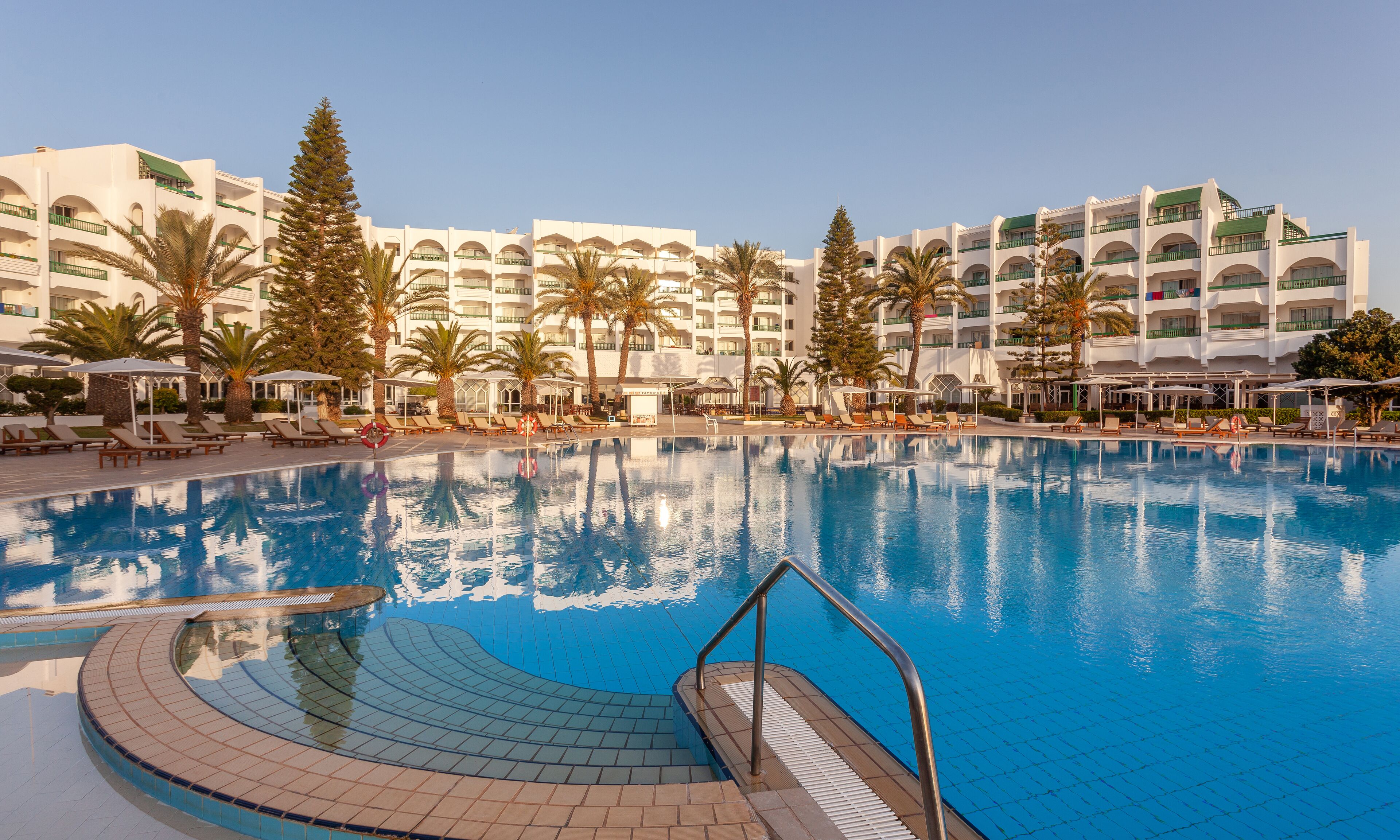 Indoor pool, outdoor pool, pool umbrellas, sun loungers
