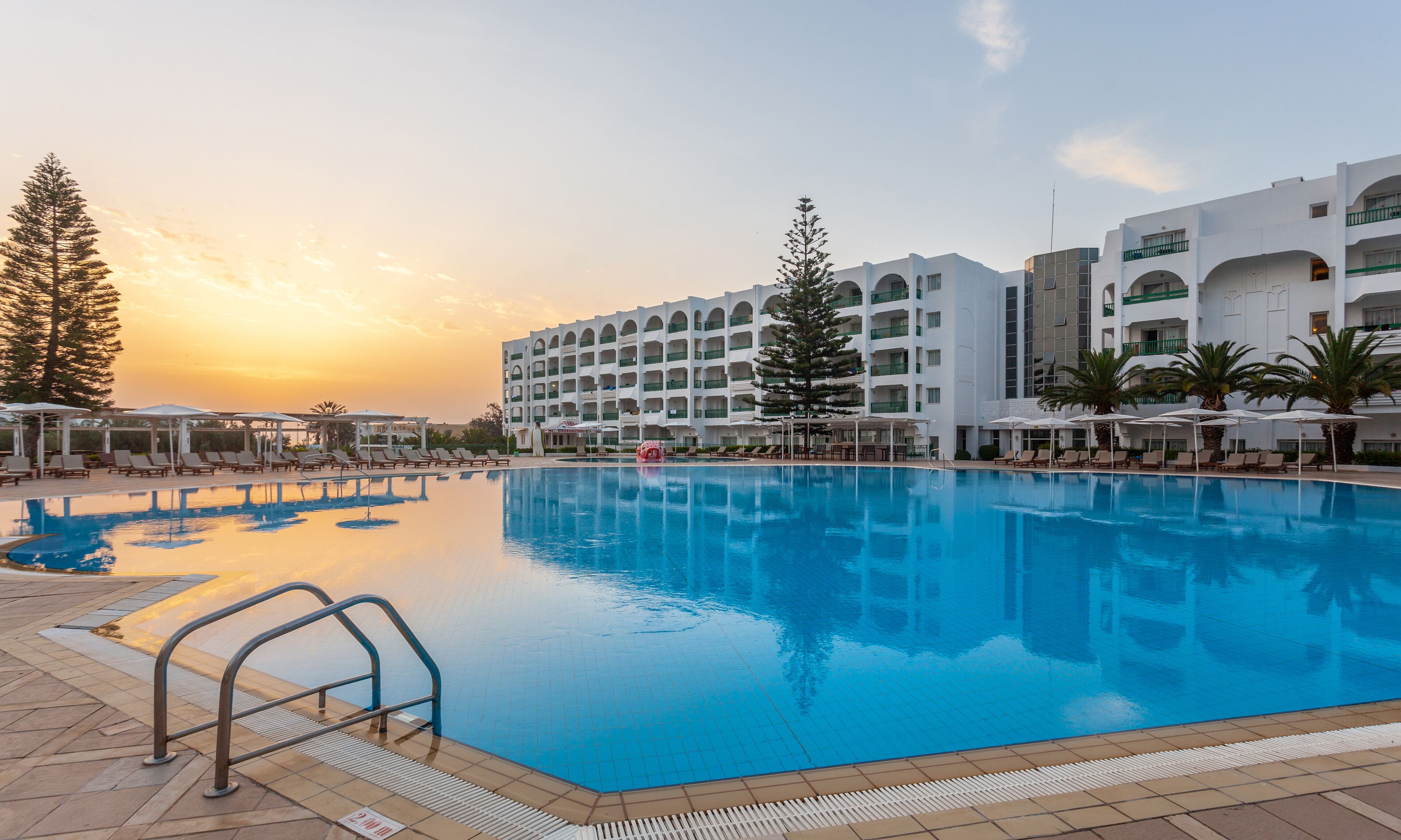 Indoor pool, outdoor pool, pool umbrellas, sun loungers
