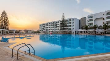 Indoor pool, outdoor pool, pool umbrellas, sun loungers