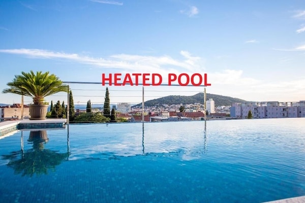 Seasonal outdoor pool, pool umbrellas, sun loungers