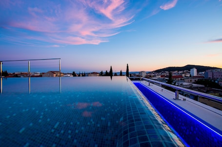 Seasonal outdoor pool, pool umbrellas, pool loungers