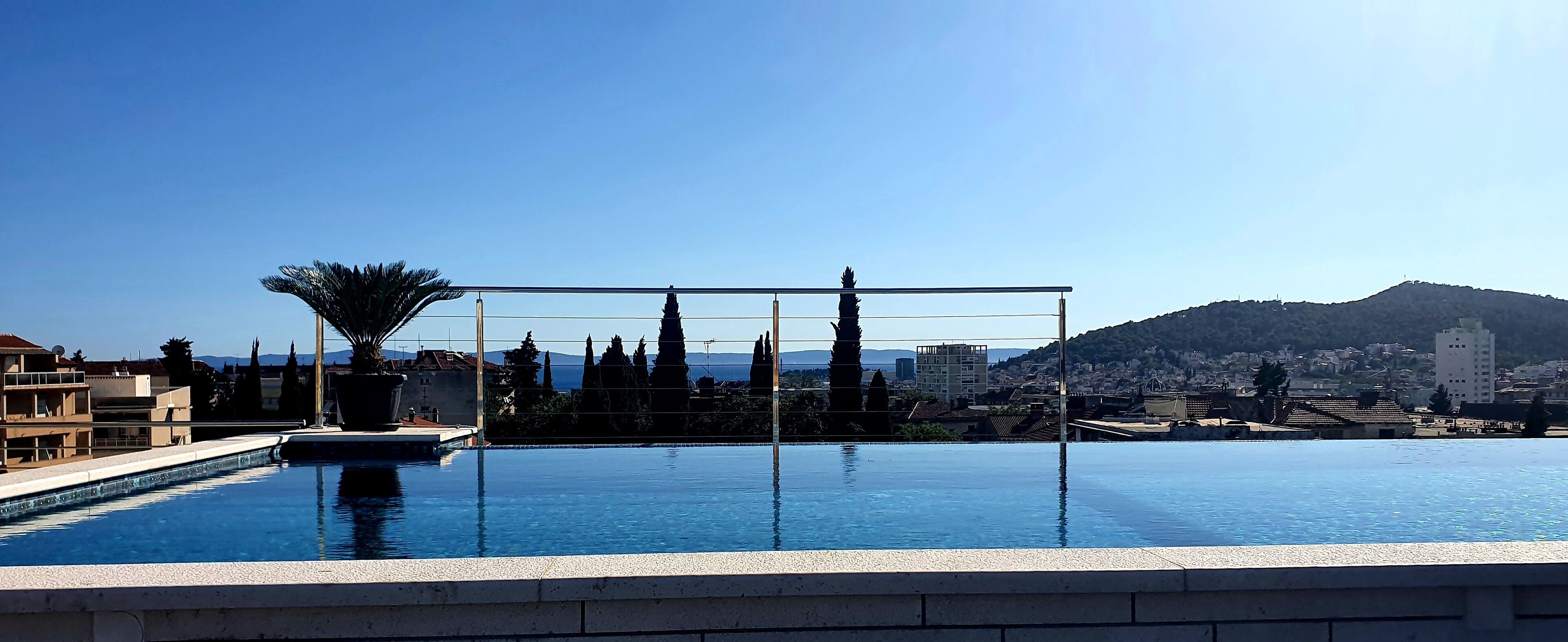 seasonal outdoor pool, pool umbrellas, pool loungers