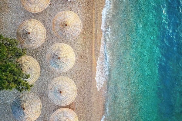 On the beach, sun loungers, beach umbrellas