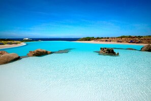 On the beach, sun loungers, beach umbrellas, snorkeling