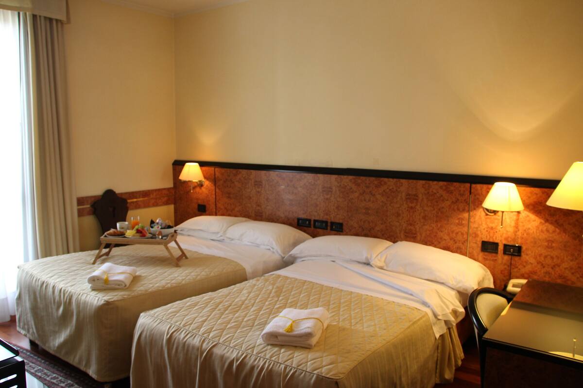 Standard Quad Room | Minibar, in-room safe, desk, soundproofing
