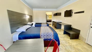 Suite, 2 Queen Beds, Kitchenette, Ground Floor | In-room safe, desk, laptop workspace, blackout drapes