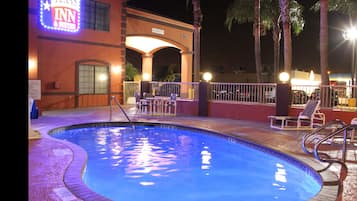 Outdoor pool, open 10:00 AM to 10:00 PM, pool loungers