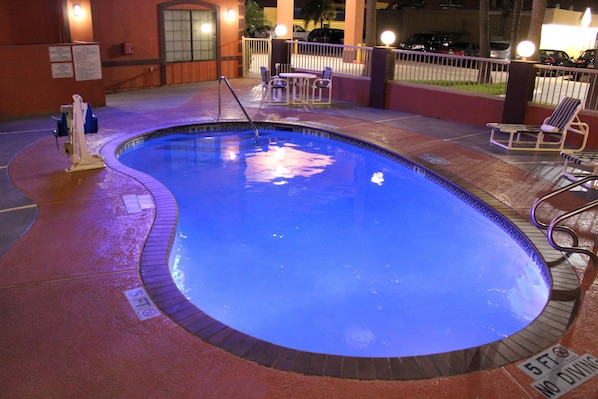 Outdoor pool, open 10:00 AM to 10:00 PM, pool loungers