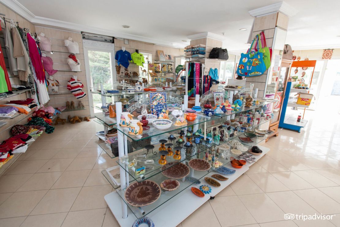 A boutique with glass display cases filled with colorful plates and decorative items.