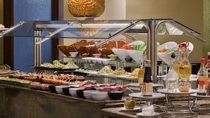 A buffet with various food items and condiments. - Bel Air Azur Resort - Adults Only (Hurghada)