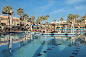 Outdoor pool, pool umbrellas, sun loungers