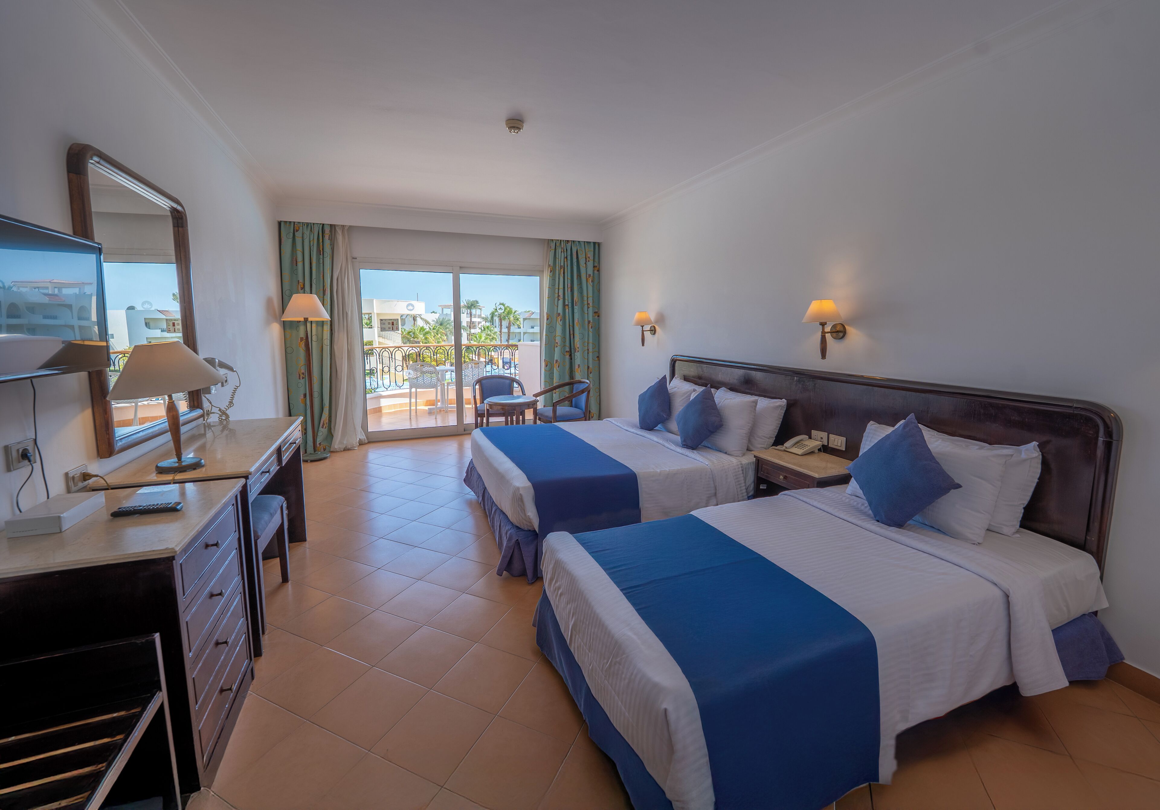 Family Room, Pool View (Deluxe, Queen or Twin) | Minibar, in-room safe