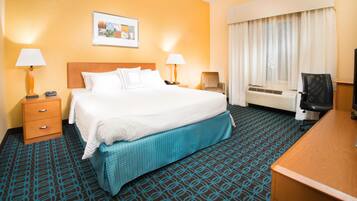 Premium bedding, desk, laptop workspace, iron/ironing board