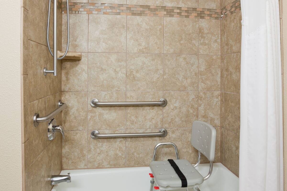 combined shower/bathtub, hair dryer, towels, soap