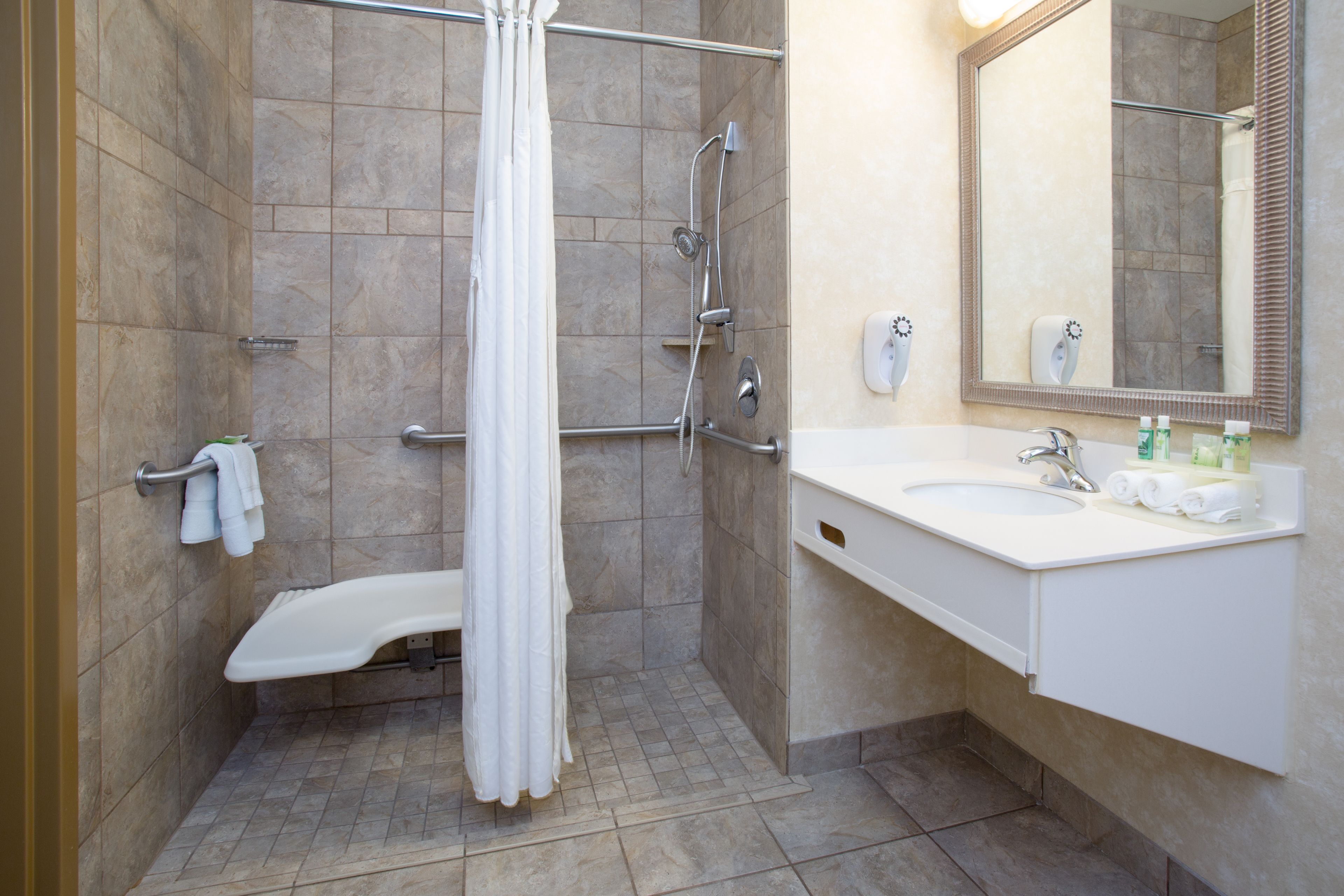combined shower/bathtub, hair dryer, towels, soap
