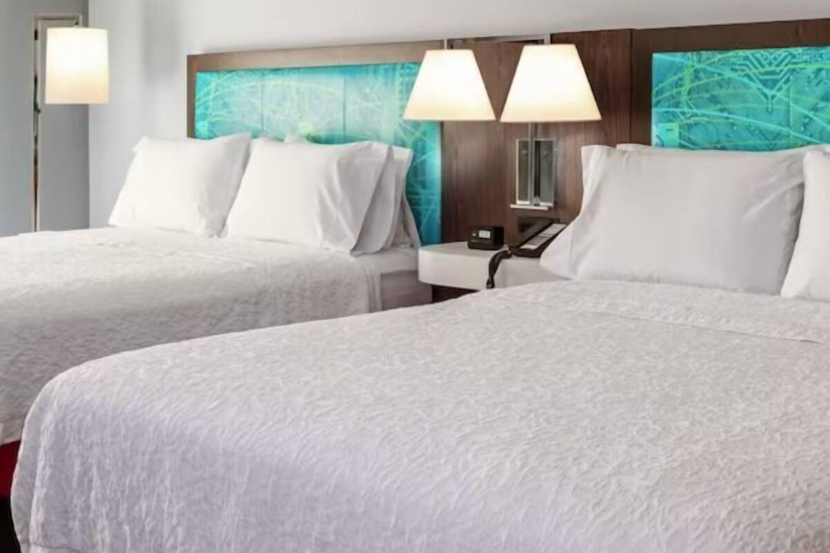 Desk, laptop workspace, iron/ironing board, free cribs/infant beds