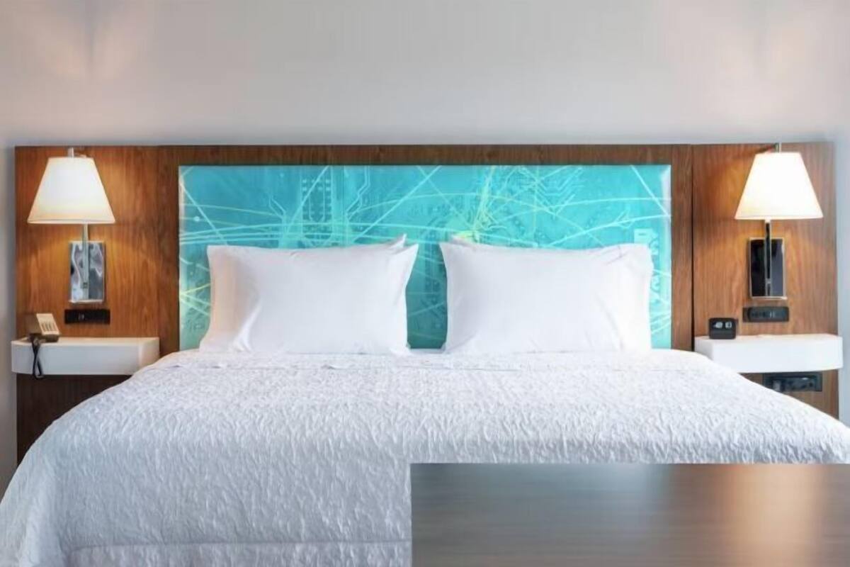 Desk, laptop workspace, iron/ironing board, free cribs/infant beds