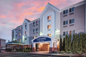 A hotel with a modern facade, multiple windows, and a sign indicating it is a Candlewood Suites. - Candlewood Suites Olympia/Lacey by IHG (Lacey)