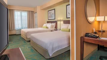 Premium bedding, down comforters, pillowtop beds, in-room safe