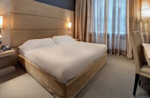 Hypo-allergenic bedding, down comforters, minibar, in-room safe