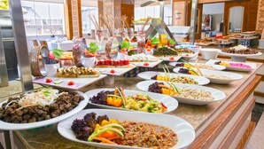 A buffet with various dishes including salads, meats, and desserts. - Monart City Hotel - All Inclusive (Alanya)