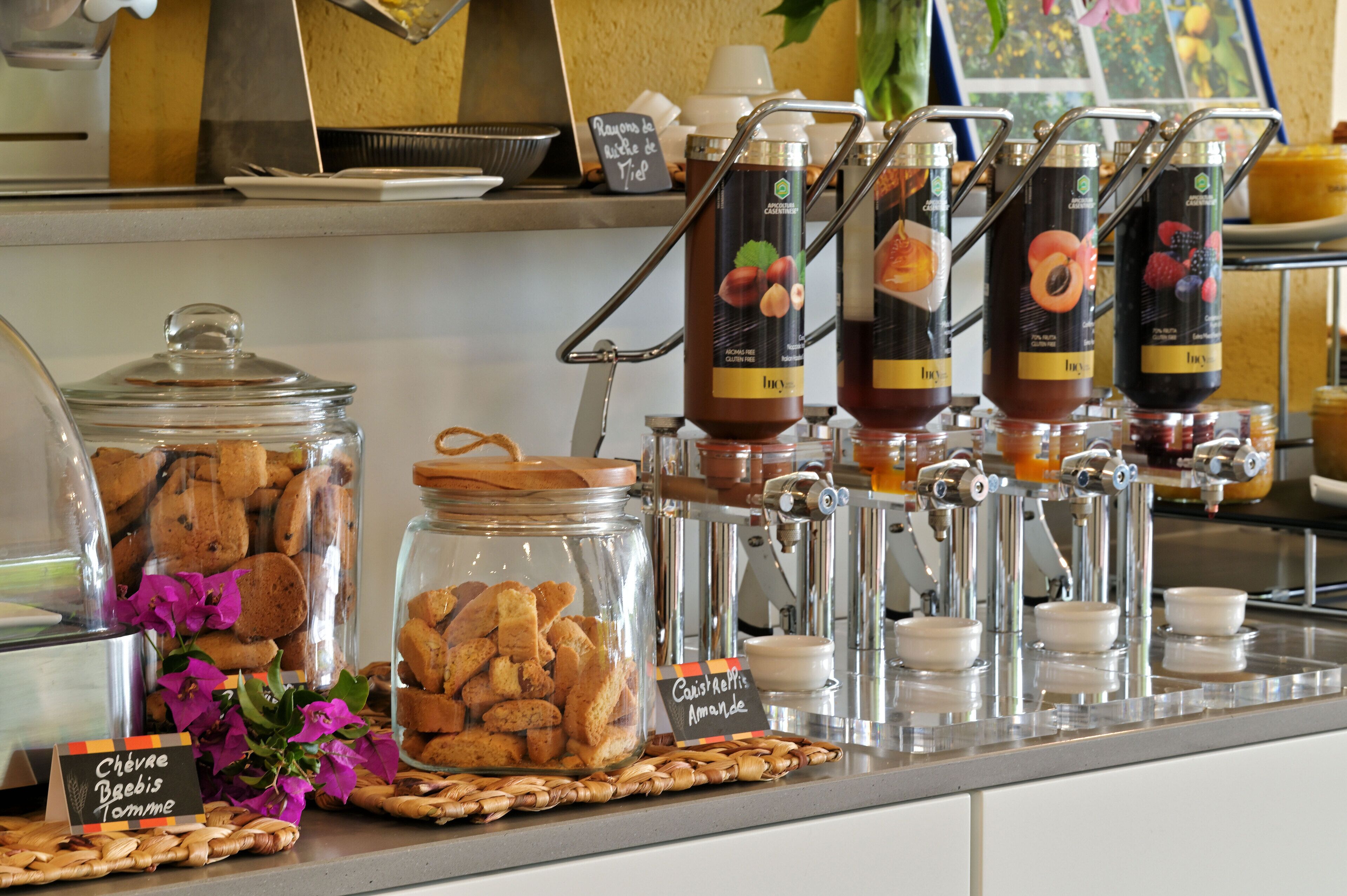 A breakfast buffet with various food items and beverages.