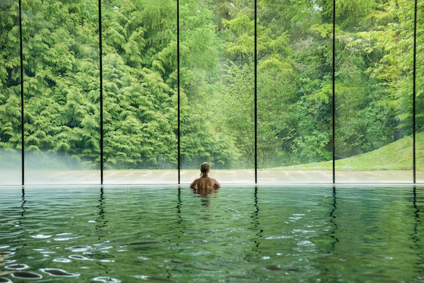 Indoor pool, outdoor pool, pool umbrellas, pool loungers