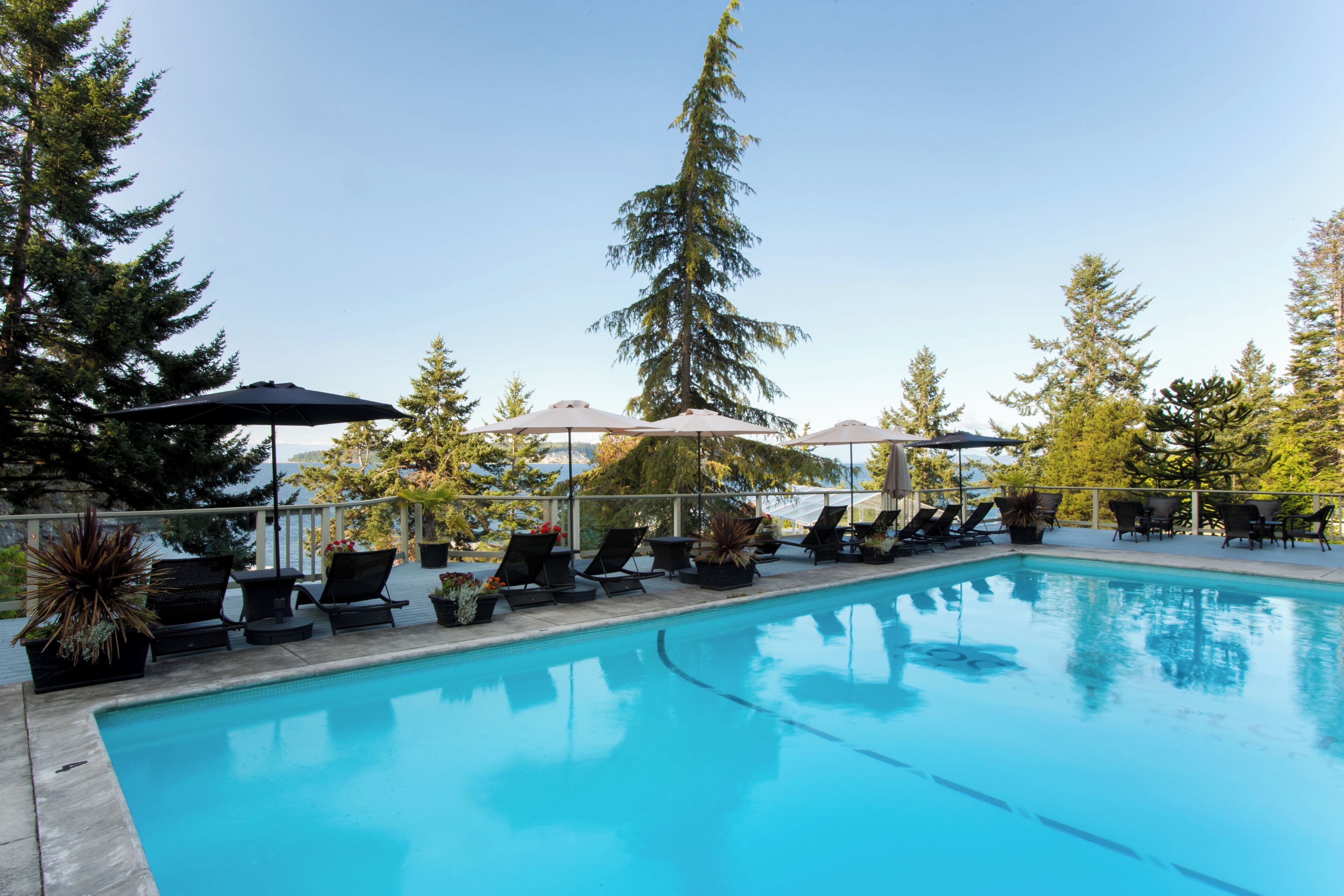 Seasonal outdoor pool, open 9:00 AM to 9:00 PM, pool umbrellas