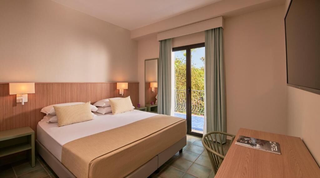 In-room safe, desk, laptop workspace, bed sheets