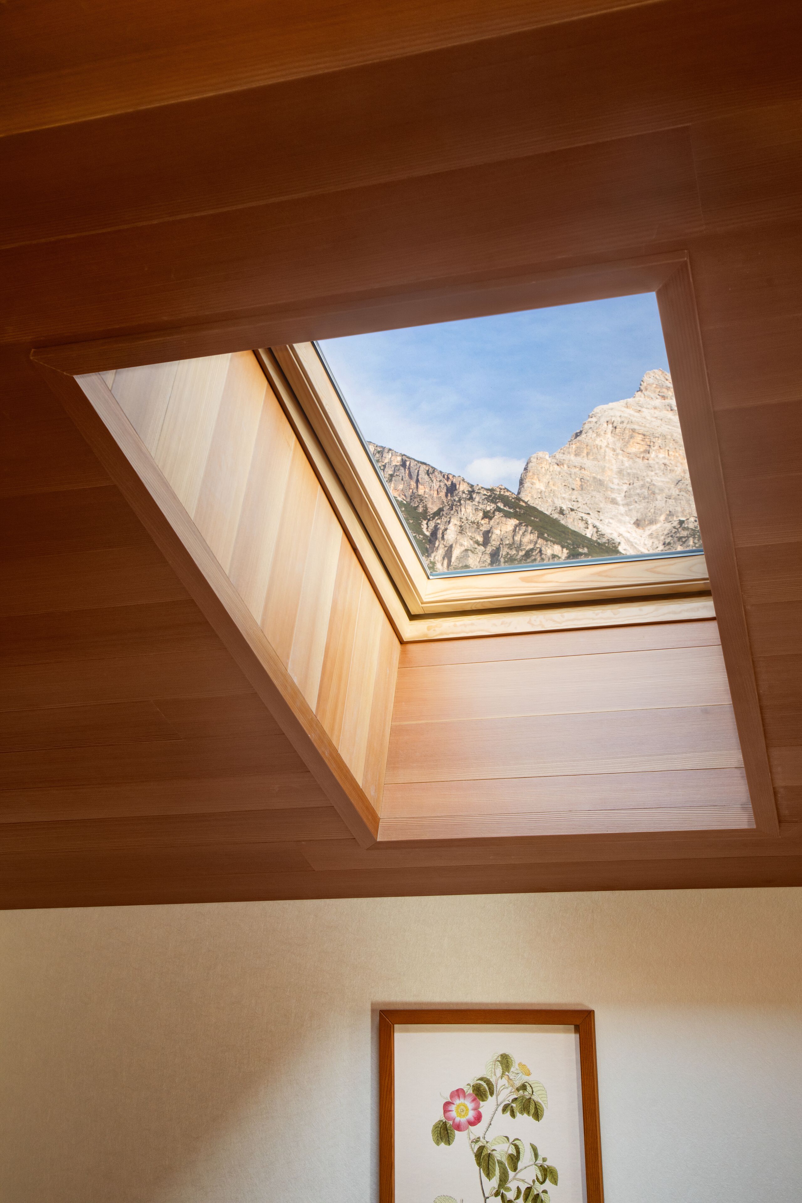 A skylight with a mountain view.