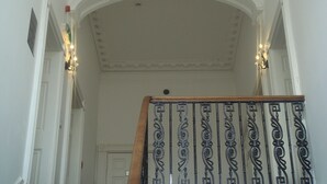 A grand staircase with ornate metal railings and a white interior. - Scotia Airport Hotel (Paisley)