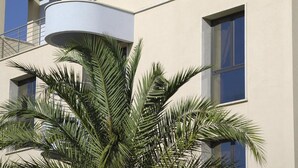 A hotel named "Tiziano Hotel" with a modern architectural design, featuring balconies and large windows. - Tiziano Hotel (Trapani)