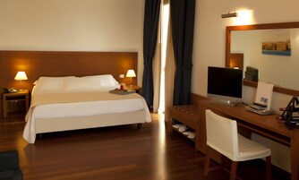 Premium bedding, down comforters, minibar, in-room safe