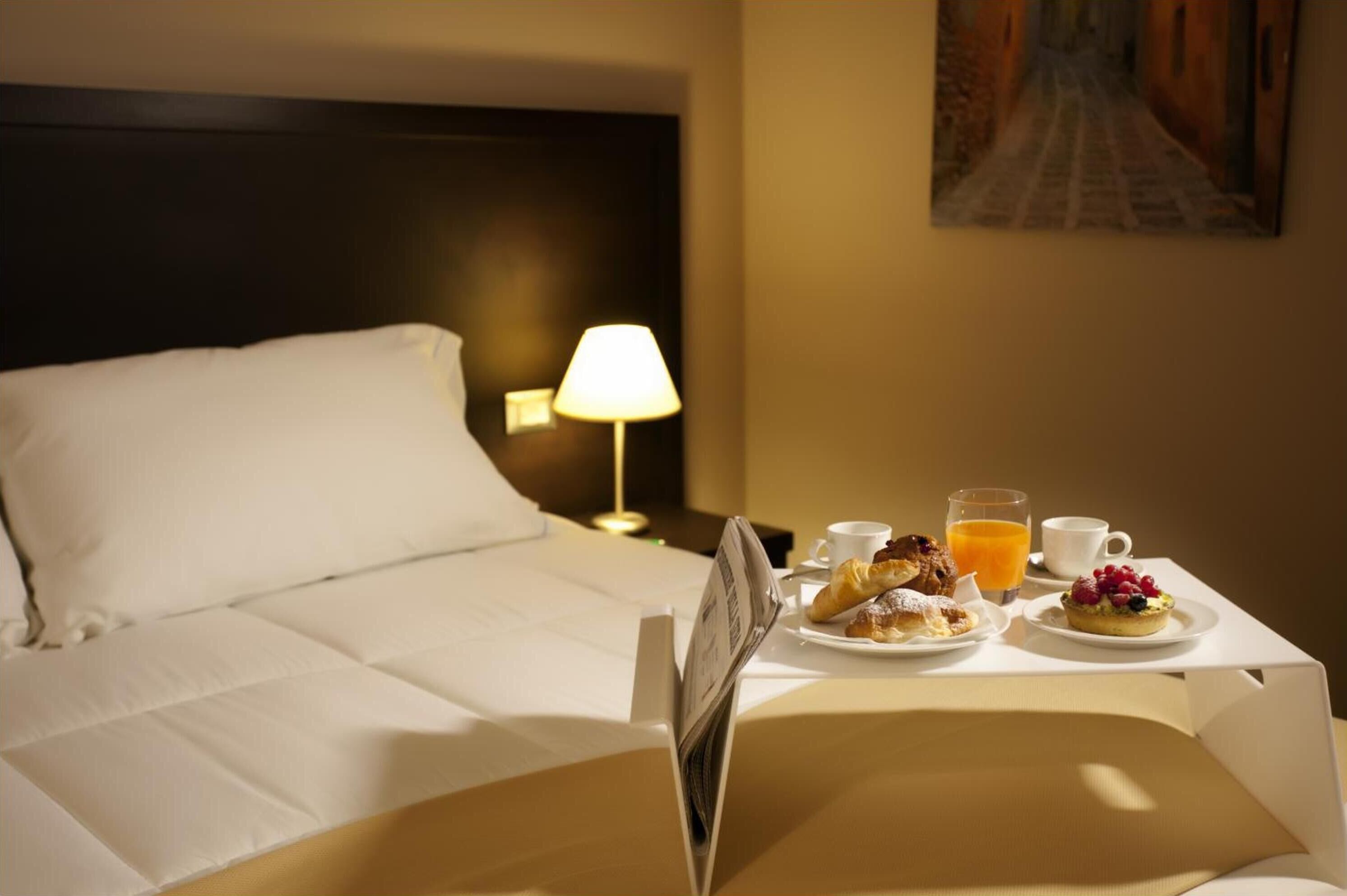 premium bedding, down duvets, minibar, in-room safe