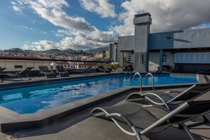 Outdoor pool, open 8:00 AM to 8:00 PM, sun loungers