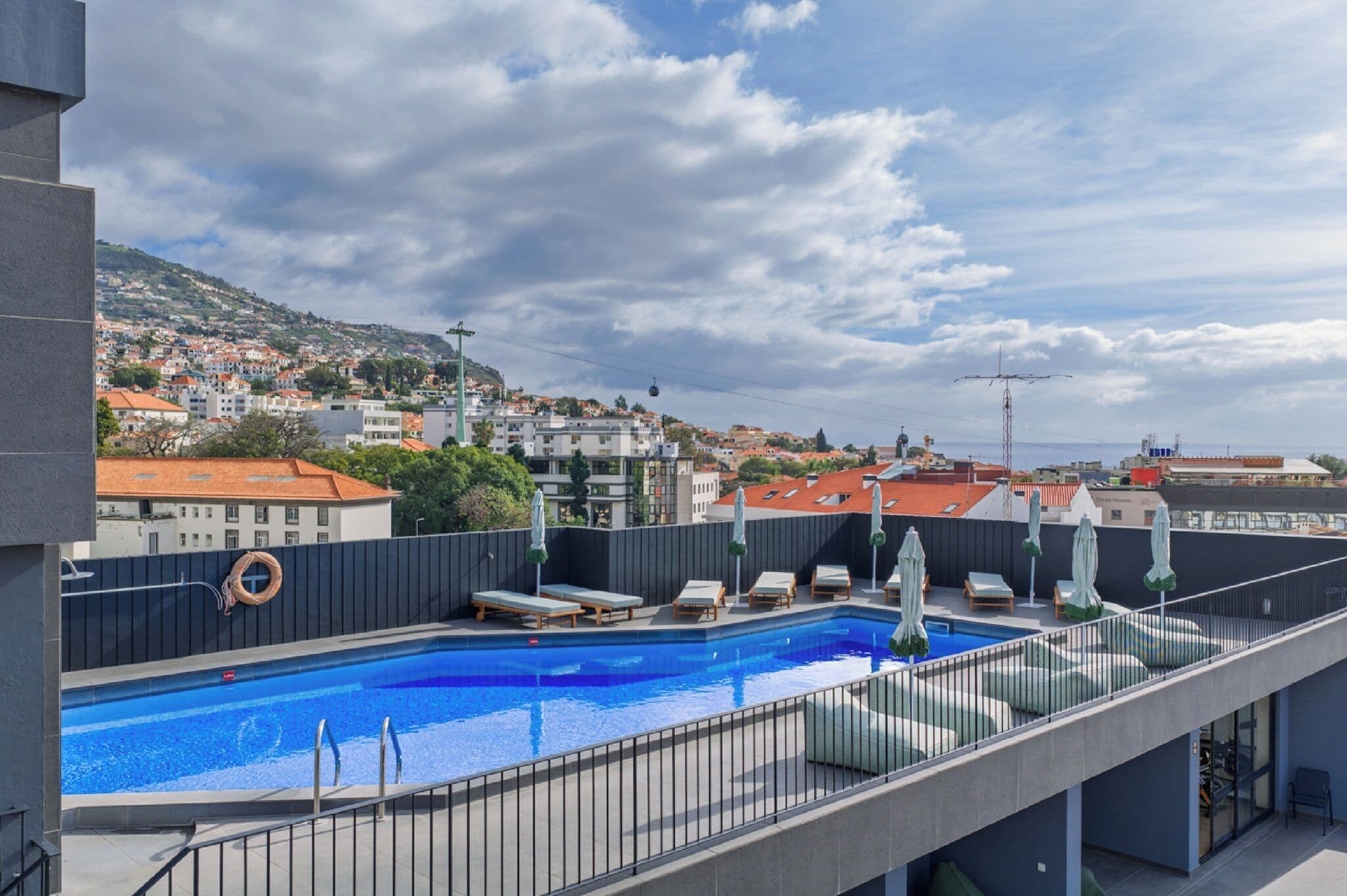 Outdoor pool, open 8:00 AM to 8:00 PM, pool loungers