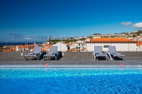 Outdoor pool, open 8:00 AM to 8:00 PM, sun loungers