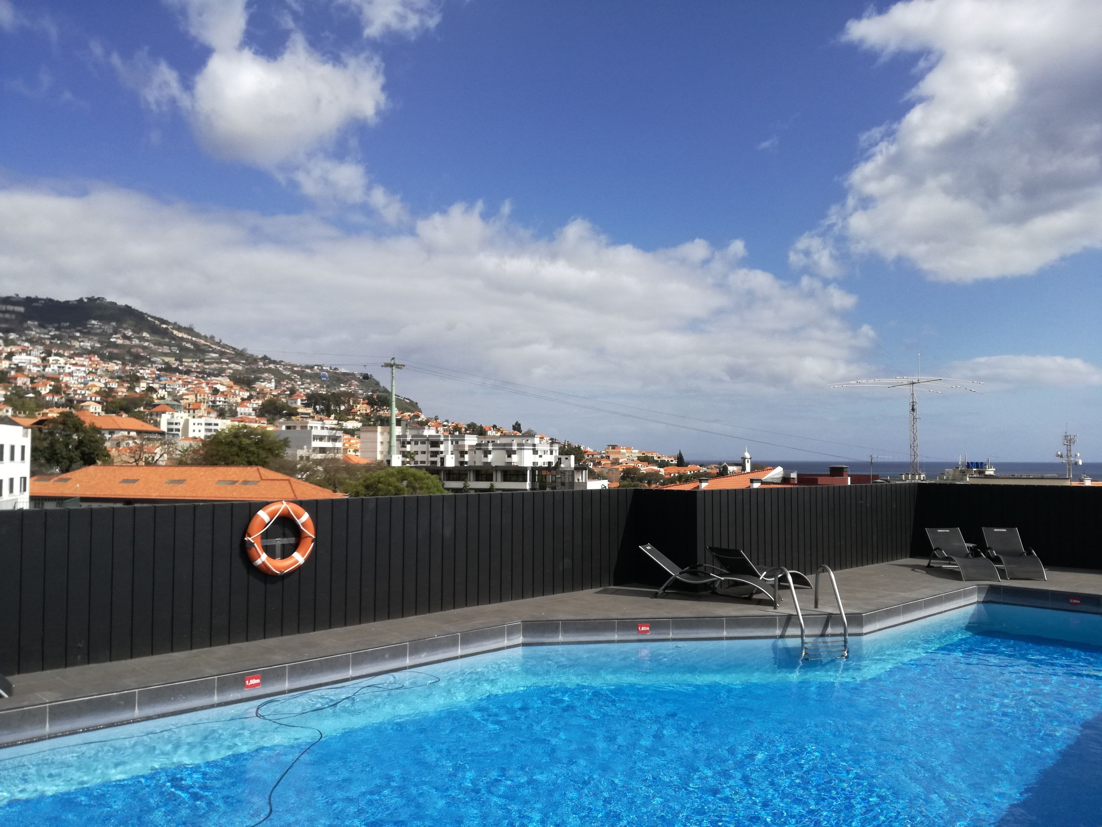 outdoor pool, open 8:00 am to 8:00 pm, pool loungers