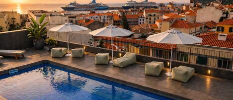 Outdoor pool, open 8:00 AM to 8:00 PM, sun loungers
