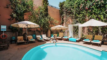 Outdoor pool, pool umbrellas, pool loungers