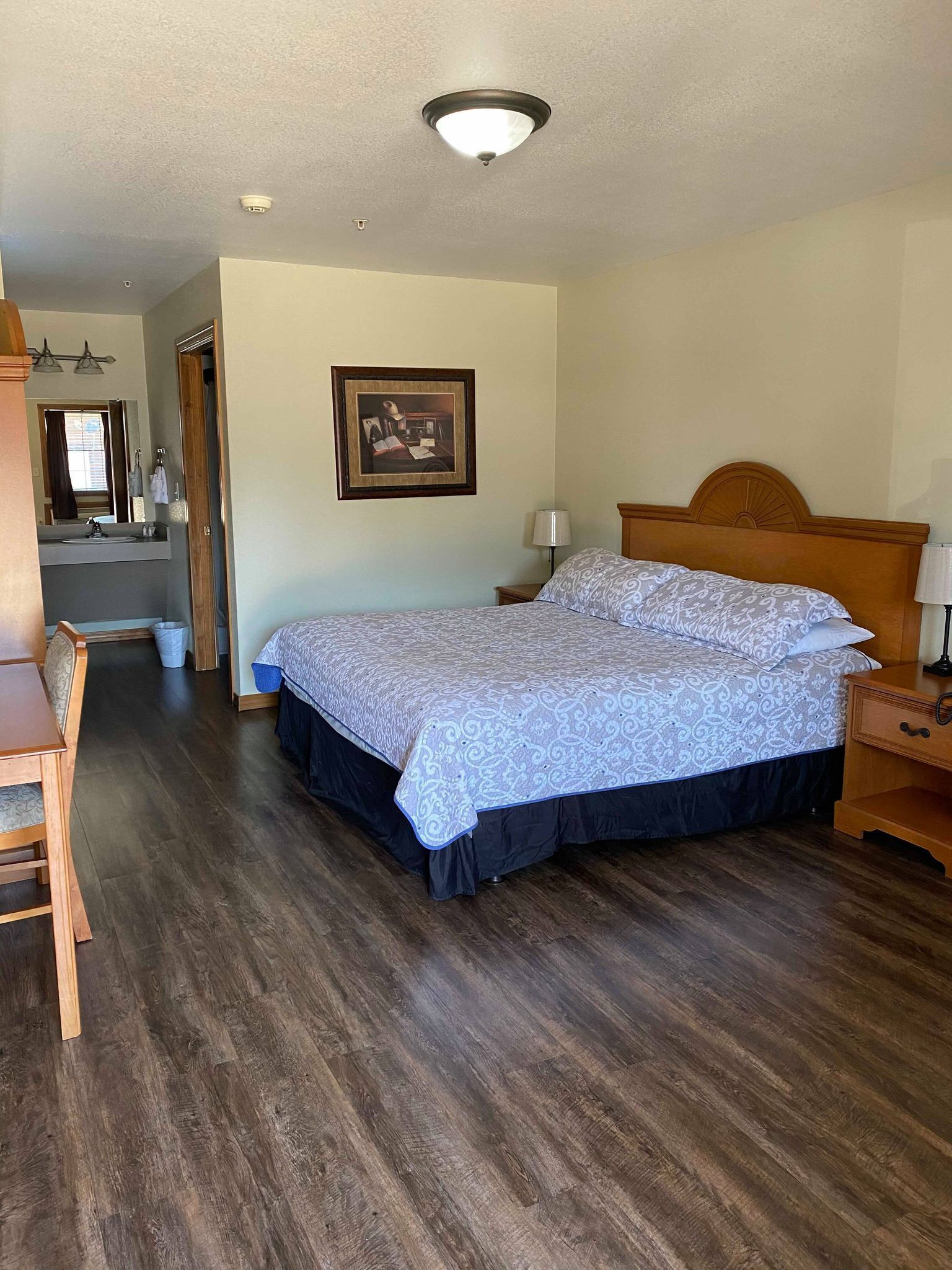 desk, iron/ironing board, bed sheets