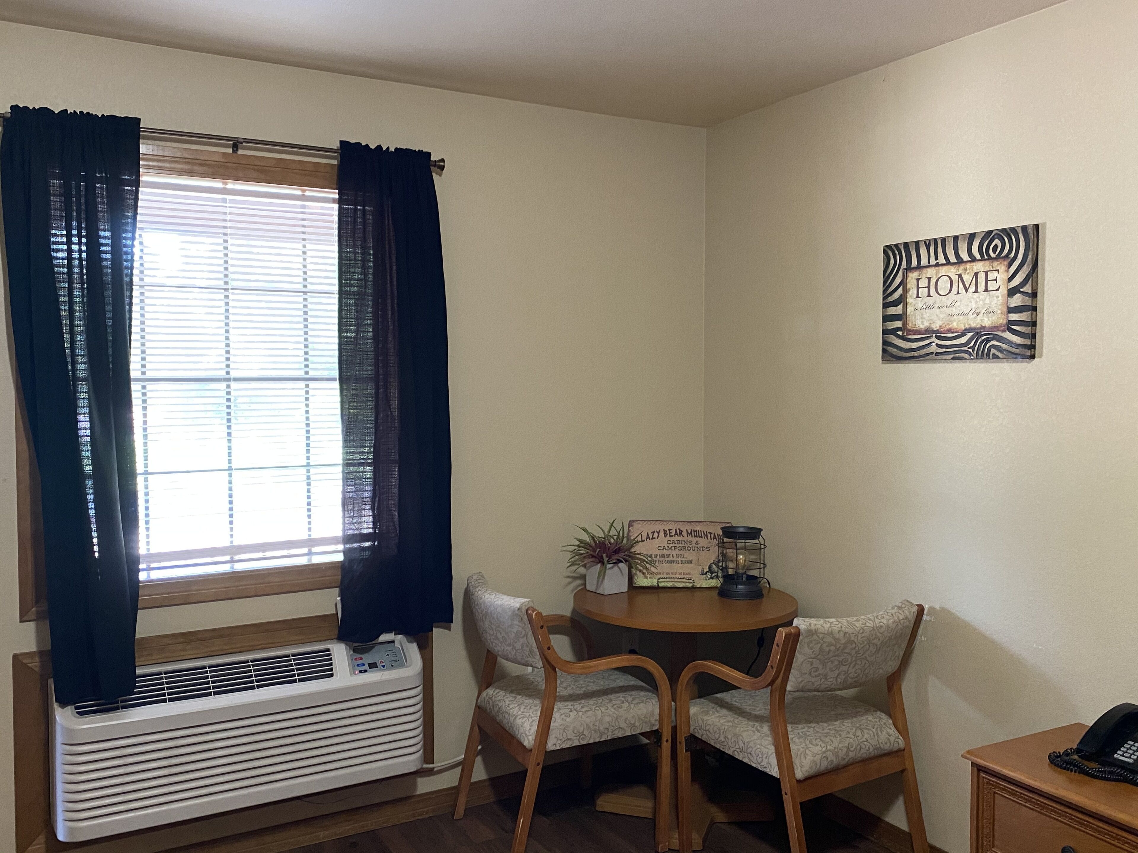 desk, iron/ironing board, bed sheets