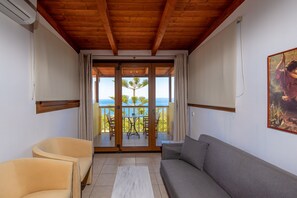 Studio Suite, Non Smoking, Sea View | Living area | LED TV
