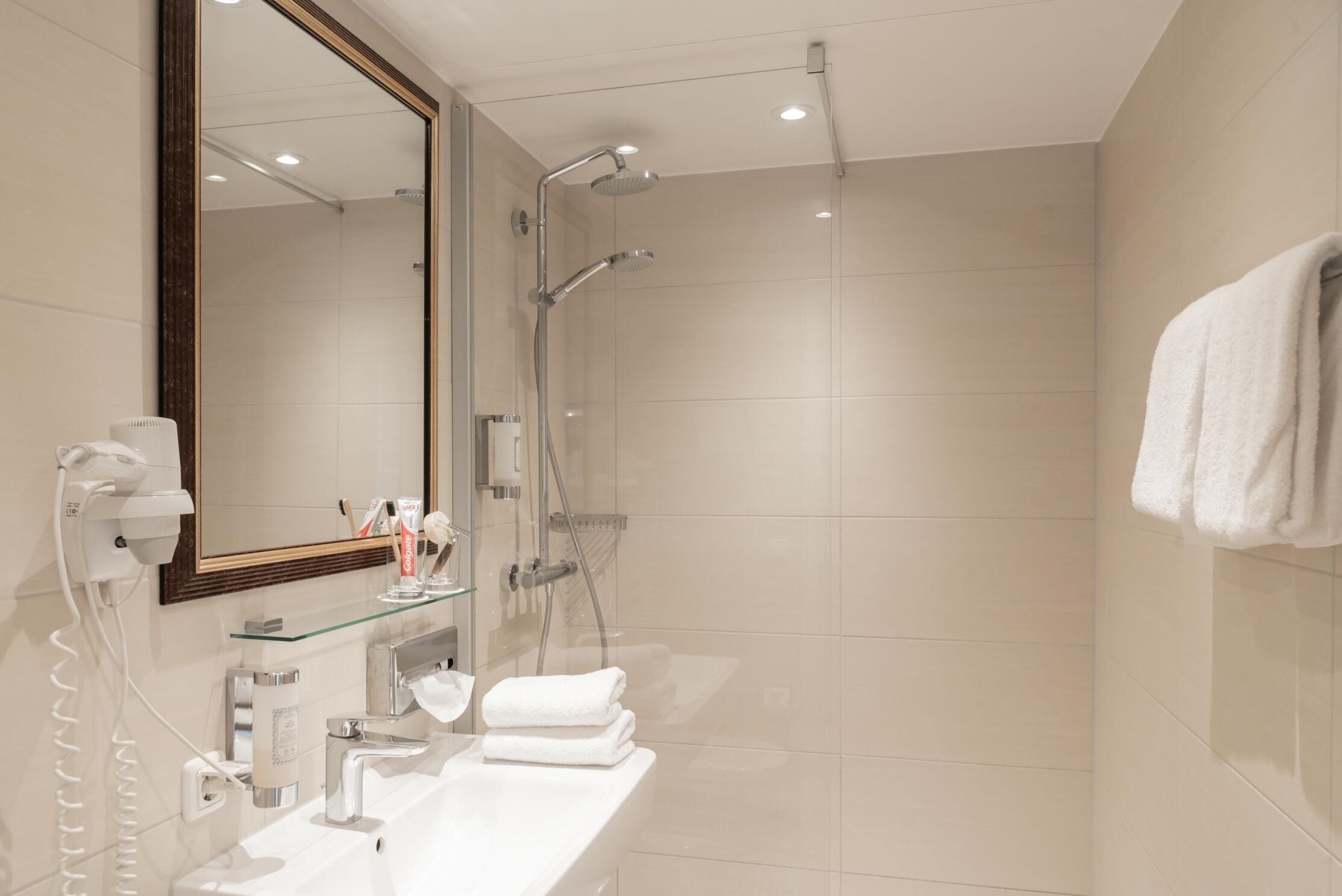 junior suite, lake view | bathroom | shower, hair dryer, towels, soap