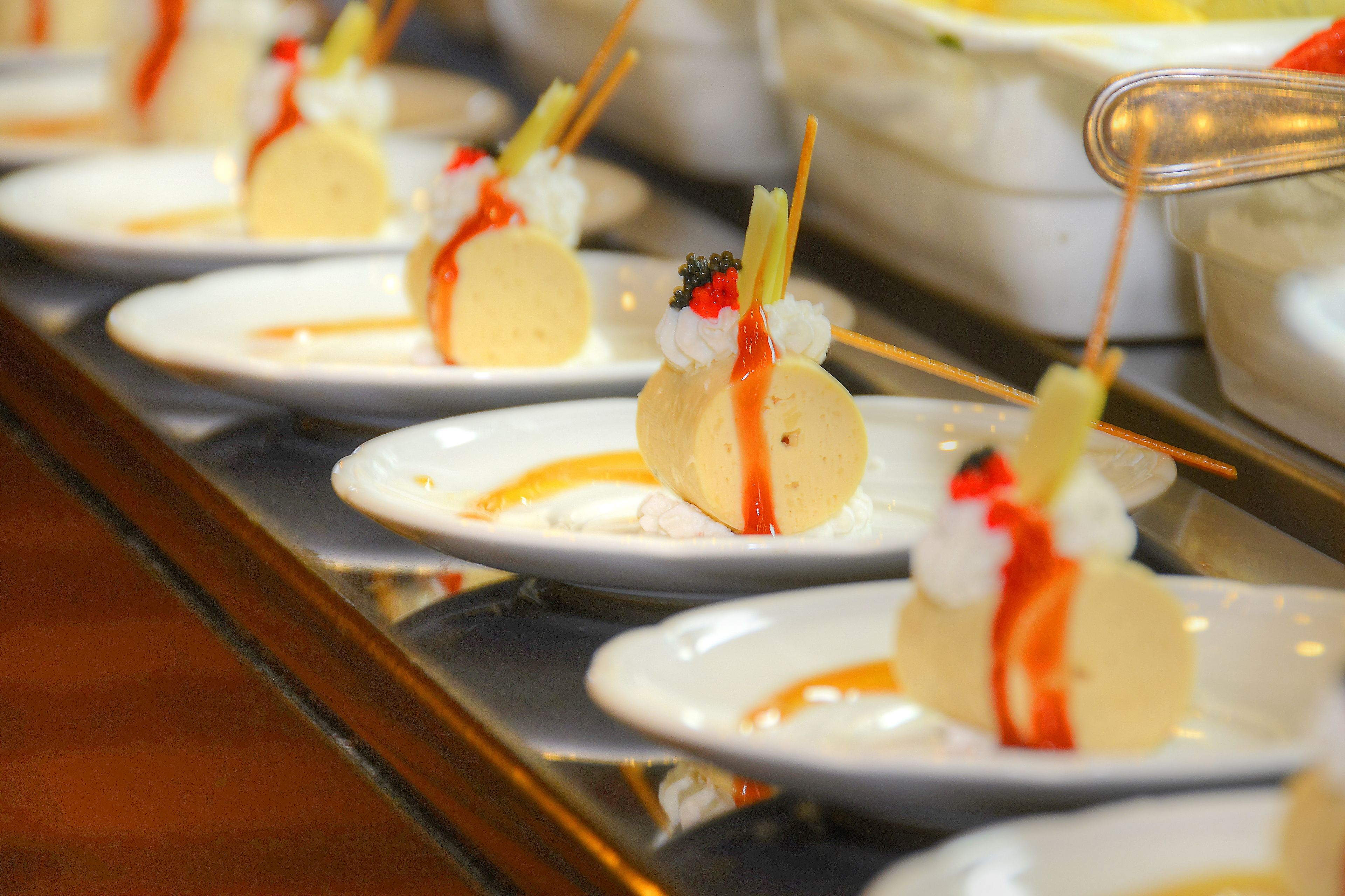 A dessert display with various plated desserts.