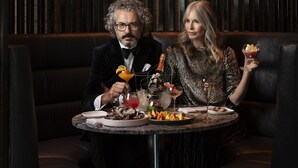 A couple dining at a table with a decorative chandelier overhead. - Sofitel Auckland Viaduct Harbour (Auckland)